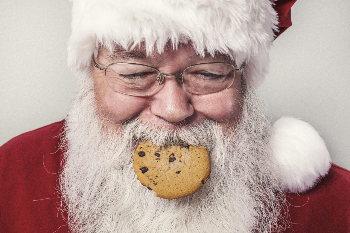 Santa Clause Eating Cookie Free Stock Photo