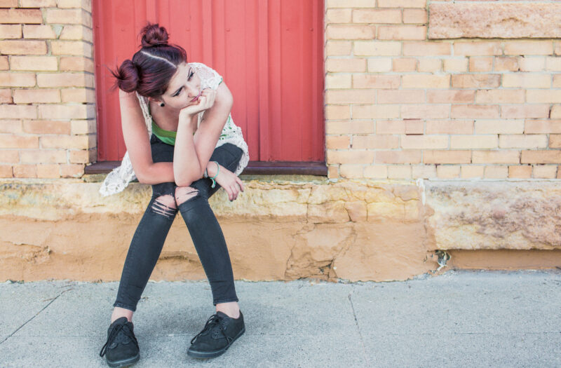 Girl Waiting on Step Free Stock Photo